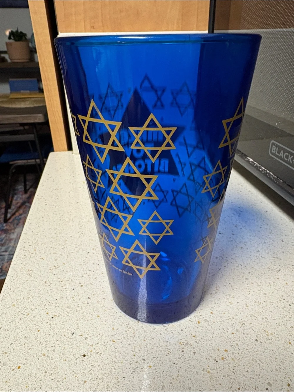 Urban Outfitters Blue Pint Glass with Gold Star and Text